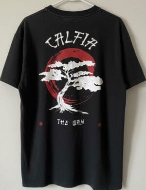 Black T-shirt with tree and circle design.